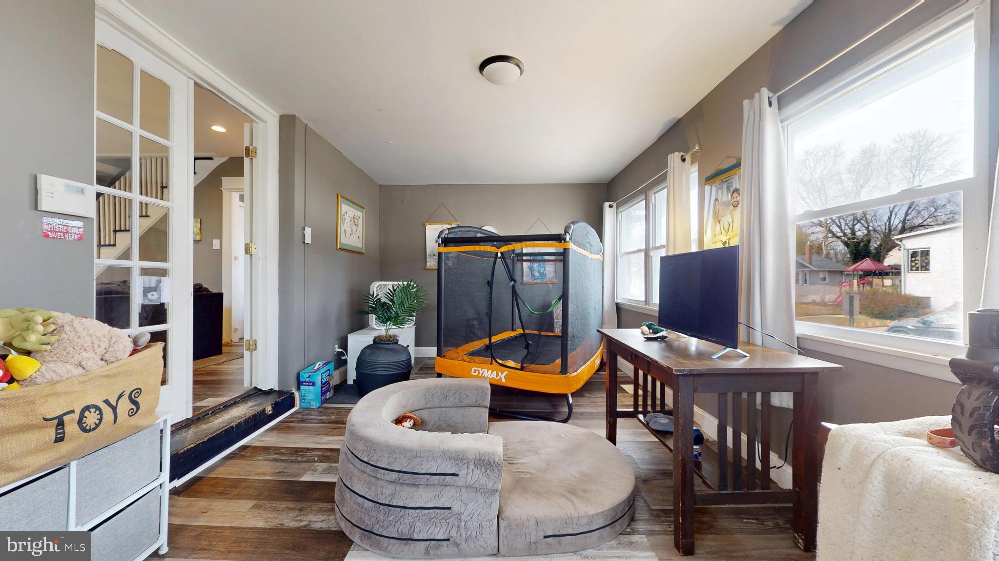 204 Haddon Avenue Collingswood, NJ 08108 - Photo 22 of 34 a living room with furniture a flat screen tv and a window