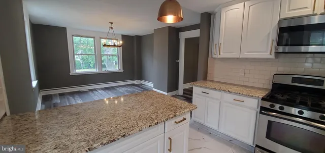 a kitchen with a stove and a sink