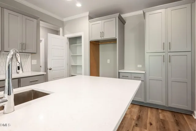 a room with a bed and cabinets