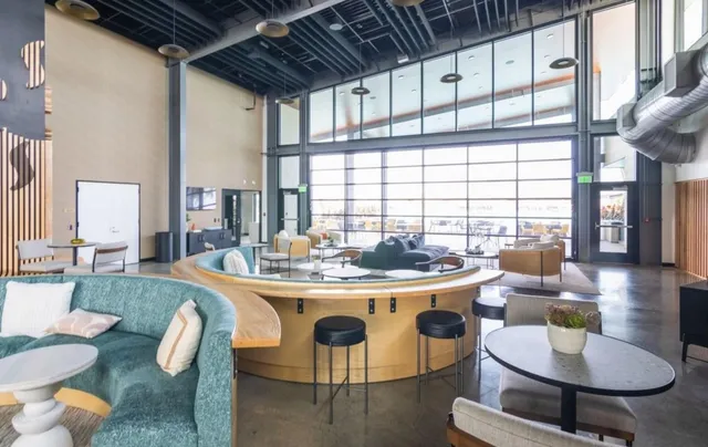 a view of a swimming pool with outdoor seating