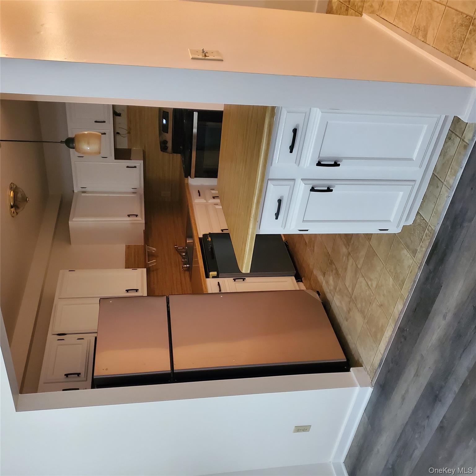160-166 W Road, Unit C34 Pleasant Valley, NY 12569 - Photo 3 of 8 a kitchen with cabinets appliances and a refrigerator