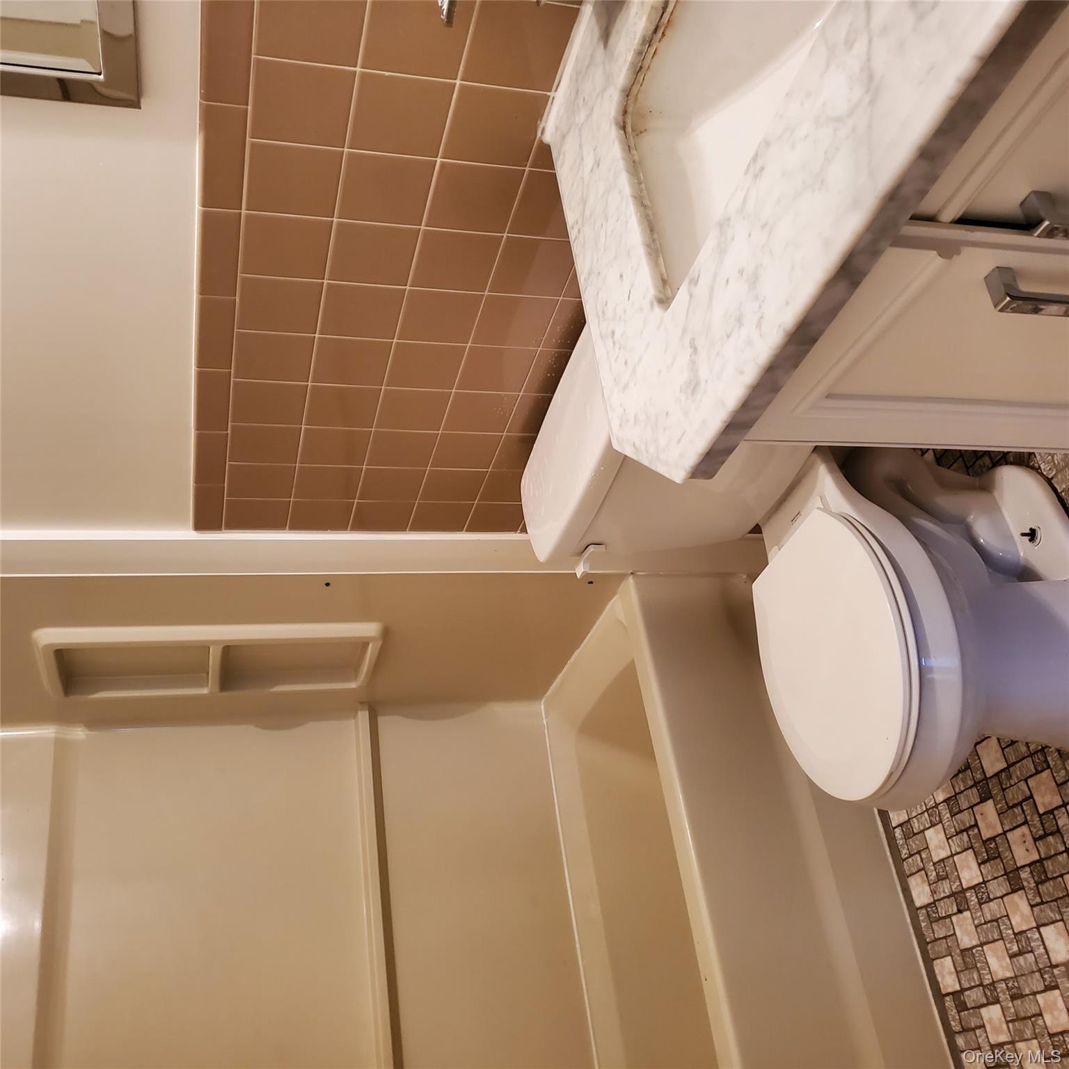 160-166 W Road, Unit C34 Pleasant Valley, NY 12569 - Photo 7 of 8 a bathroom with a sink a toilet and shower