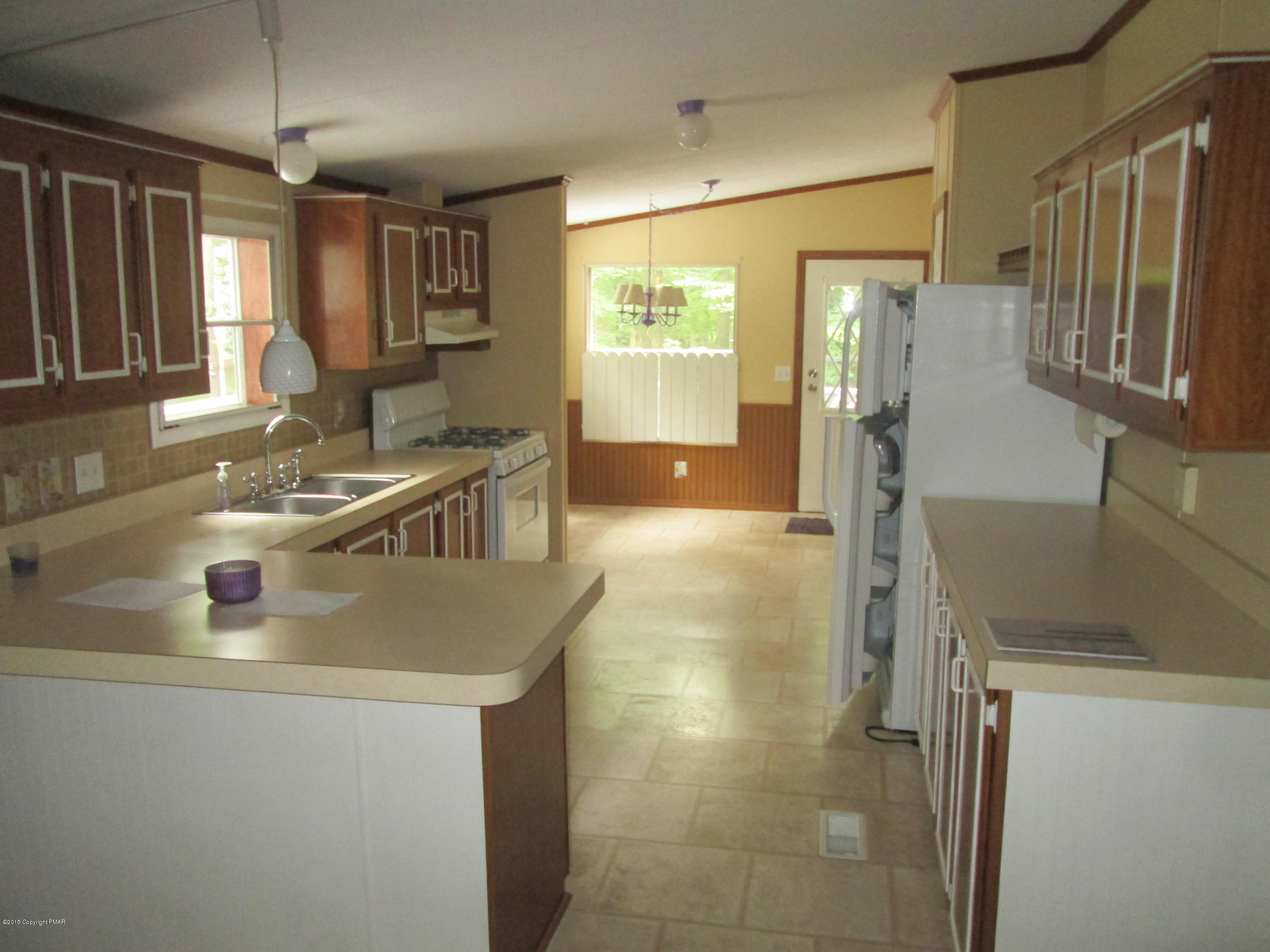 1907 Donalds Road Effort, PA 18330 - Photo 5 of 9 a kitchen with stainless steel appliances granite countertop a sink a stove and a refrigerator
