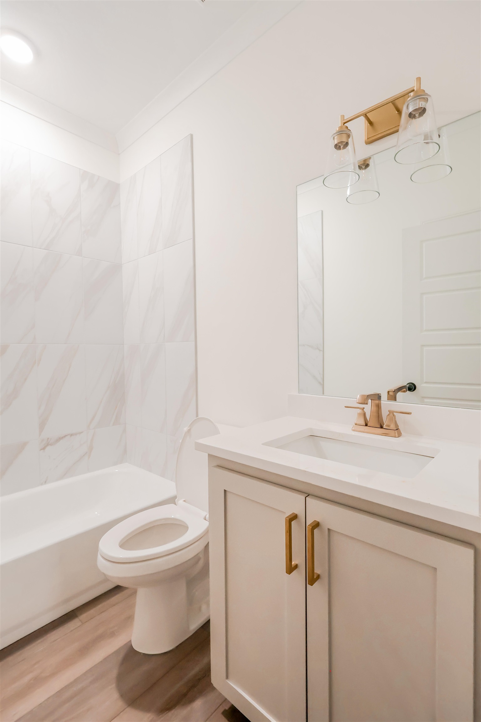 125 Columbia Way Atoka, TN 38004 - Photo 14 of 28 a bathroom with a sink a toilet and a bathtub