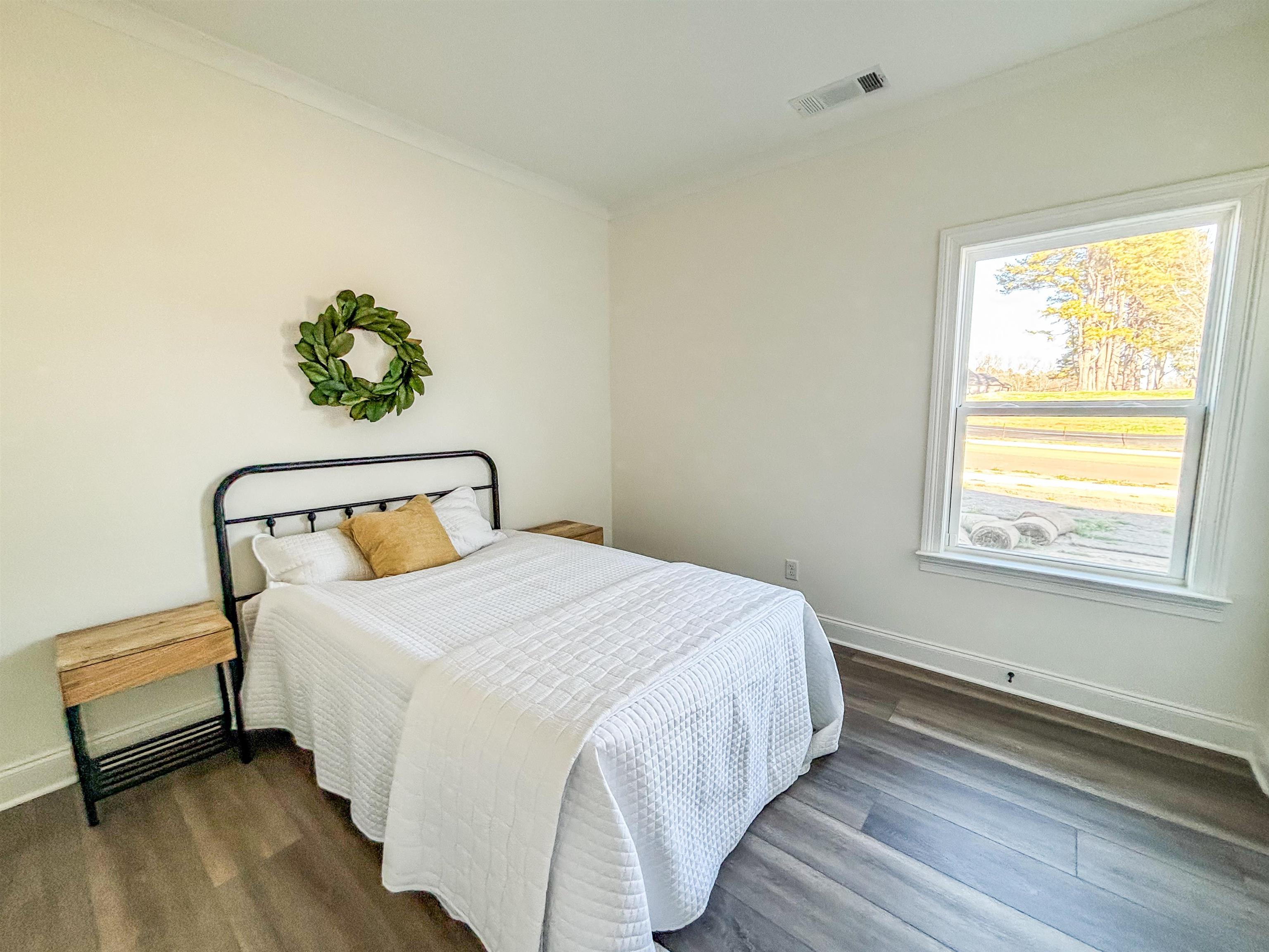 125 Columbia Way Atoka, TN 38004 - Photo 16 of 27 a bedroom with a bed and a window