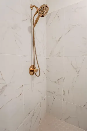 a bathroom with a sink a toilet and shower curtain