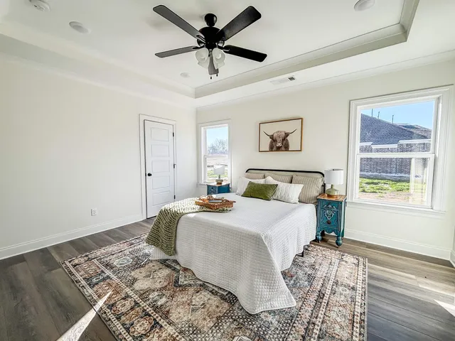 a bedroom with a large bed and a window