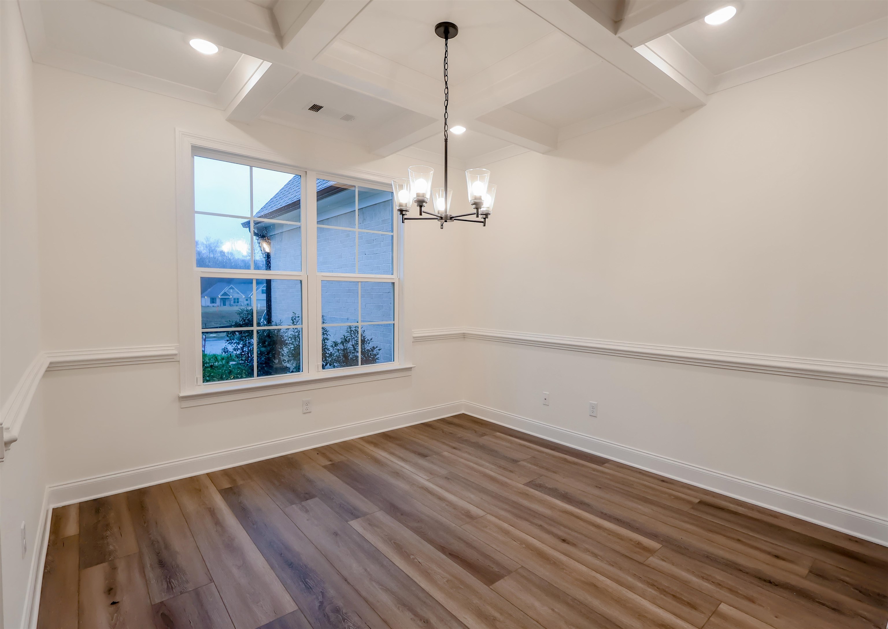 125 Columbia Way Atoka, TN 38004 - Photo 7 of 28 a view of a room with wooden floor chandelier and a window