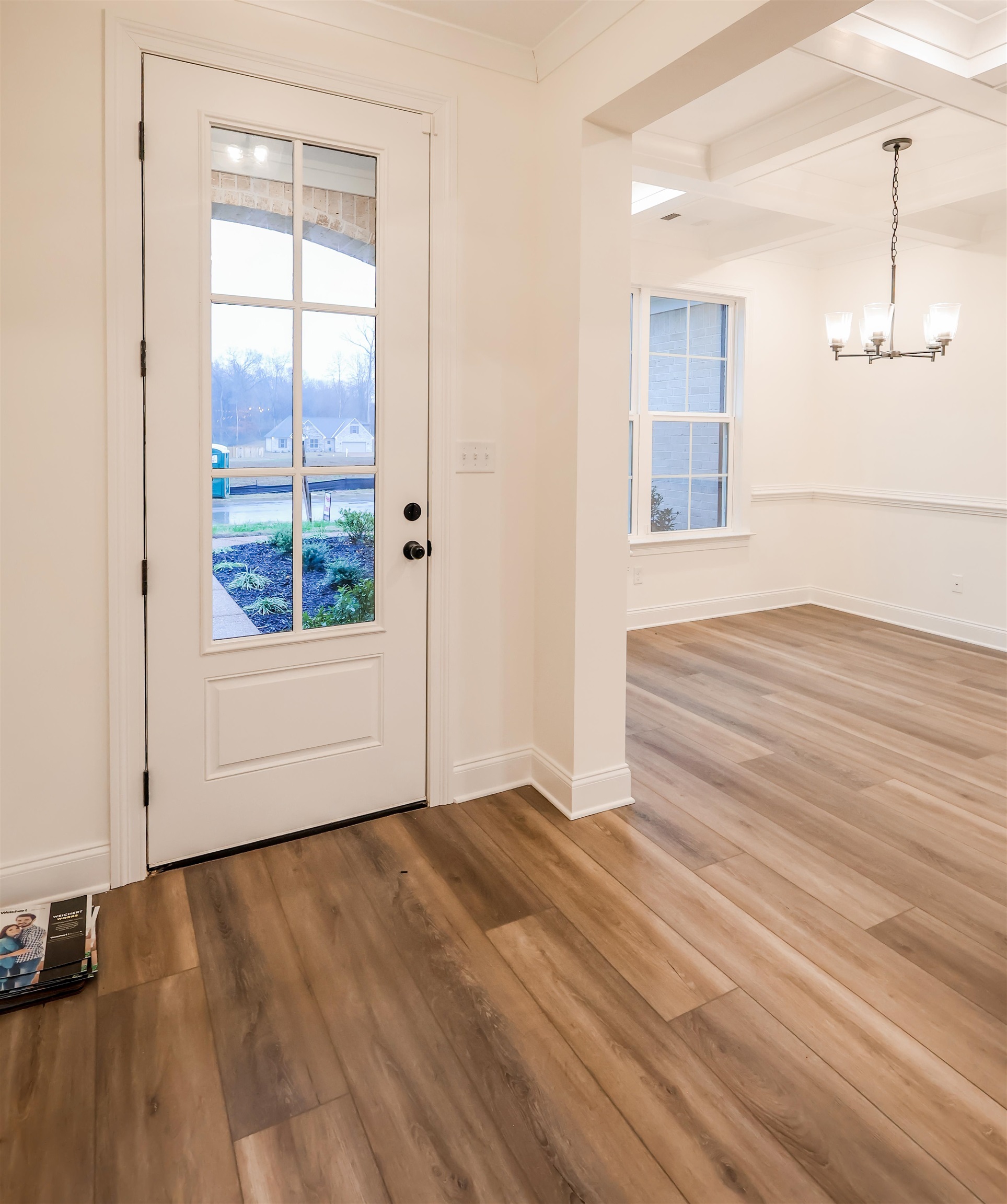 125 Columbia Way Atoka, TN 38004 - Photo 8 of 28 a view of an empty room with wooden floor and a window