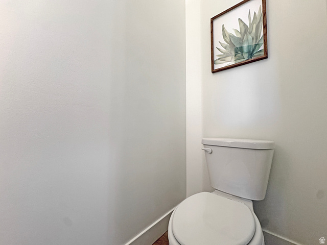 851 Grandview Drive Morgan, UT 84050 - Photo 31 of 68 White porcelain toilet with a standard flush lever and a white toilet seat