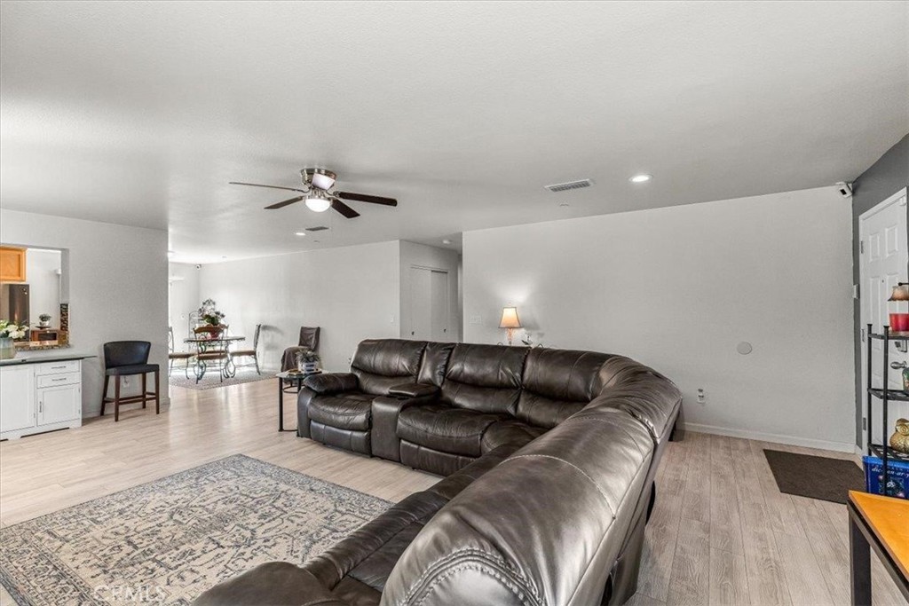 784 Taryn Court Merced, CA 95341 - Photo 11 of 39 a living room with furniture and wooden floor