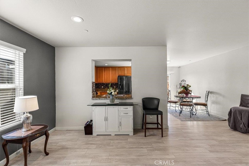 784 Taryn Court Merced, CA 95341 - Photo 12 of 39 a living room with furniture and a wooden floor