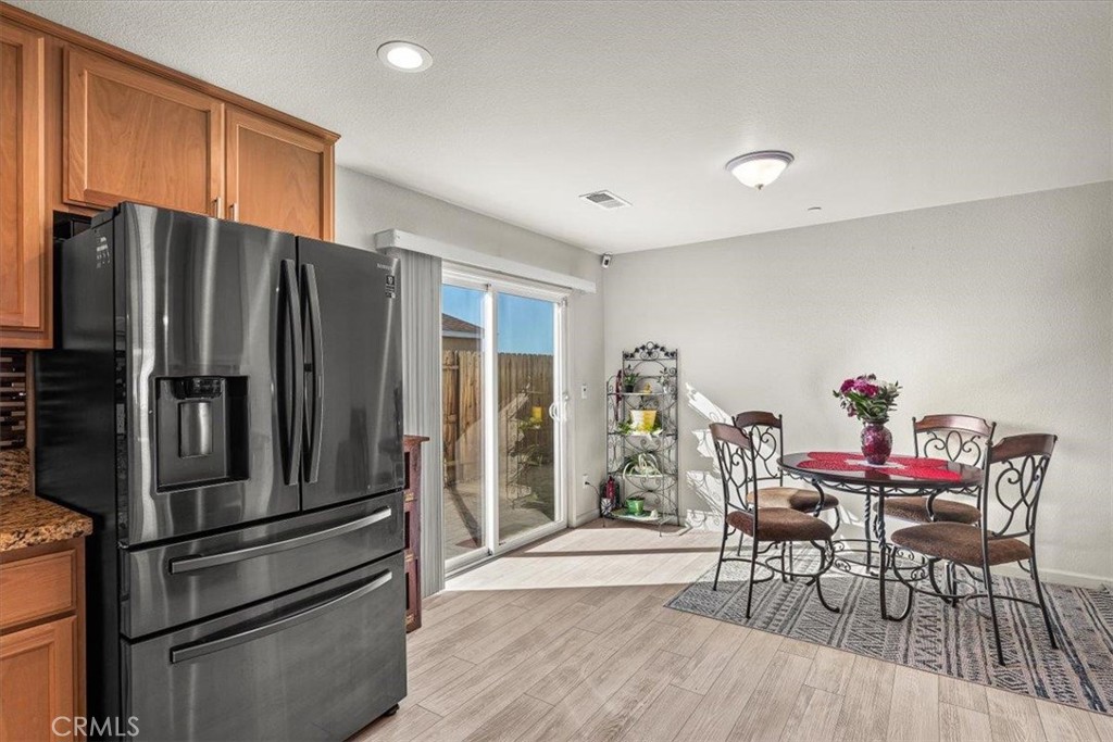784 Taryn Court Merced, CA 95341 - Photo 19 of 39 a kitchen with stainless steel appliances granite countertop a refrigerator and a stove top oven