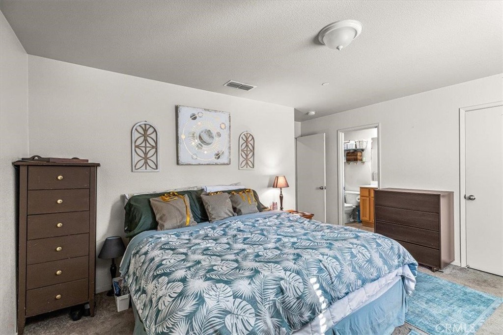 784 Taryn Court Merced, CA 95341 - Photo 24 of 39 a bedroom with a bed and a dresser