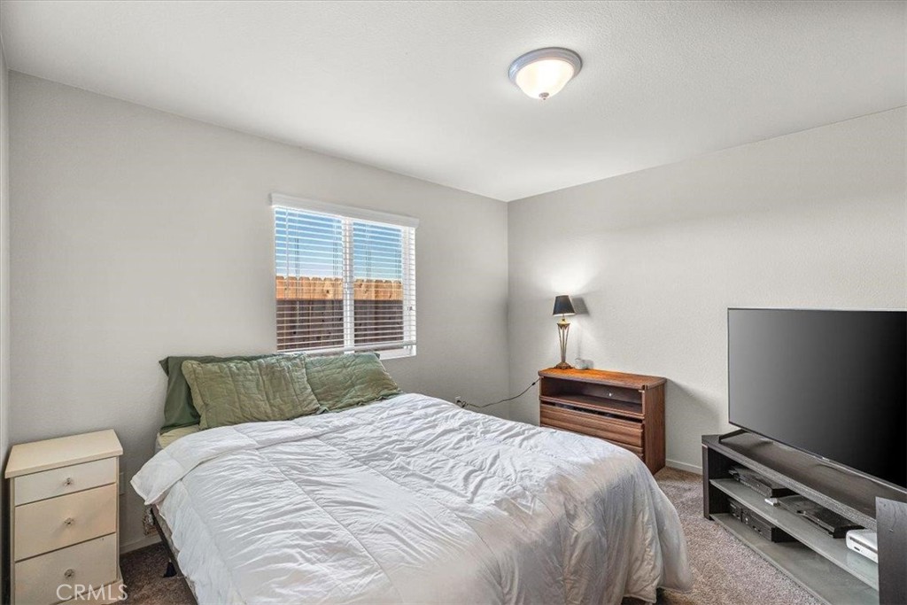 784 Taryn Court Merced, CA 95341 - Photo 29 of 39 a bedroom with a bed and a window