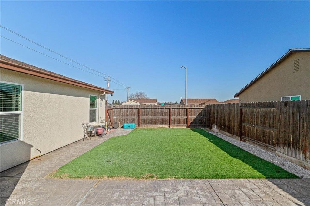 784 Taryn Court Merced, CA 95341 - Photo 34 of 39 a view of a backyard with a garden