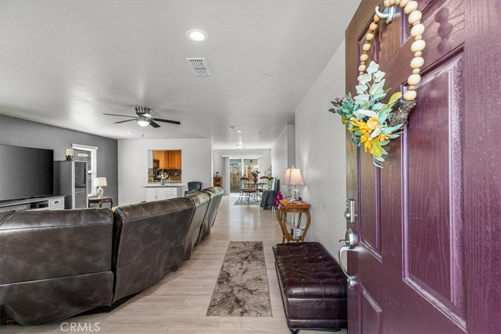 784 Taryn Court Merced, CA 95341 - Photo 6 of 39 a living room with furniture and a flat screen tv