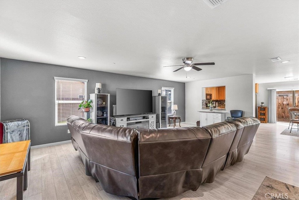 784 Taryn Court Merced, CA 95341 - Photo 7 of 39 a living room with furniture and a flat screen tv