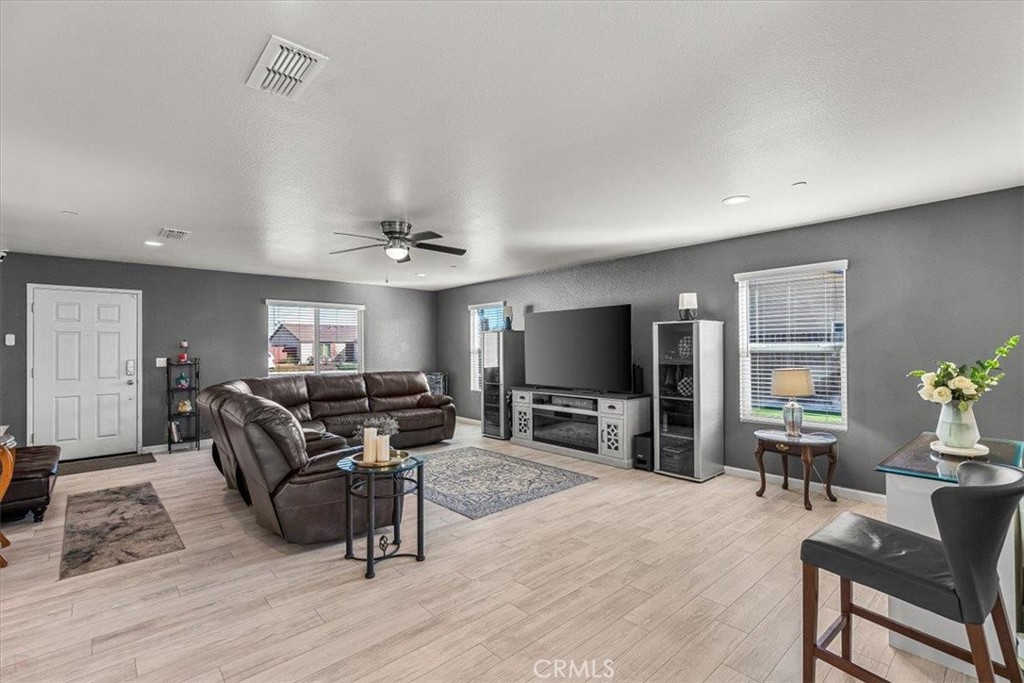 784 Taryn Court Merced, CA 95341 - Photo 9 of 39 a living room with furniture and a flat screen tv