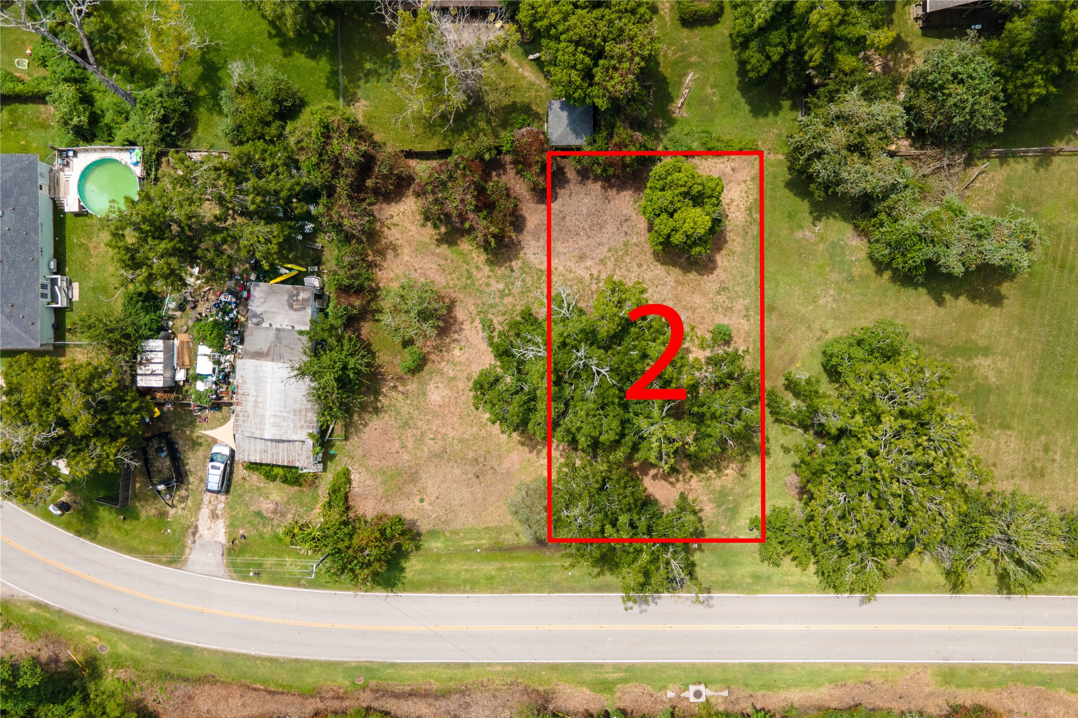 0 Red Bluff Road Seabrook, TX 77586 - Photo 4 of 7 an aerial view of a house with a yard and large trees