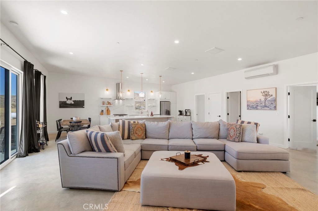 5145 Tom Mix Road Pioneertown, CA 92268 - Photo 12 of 75 a living room with furniture and a couch