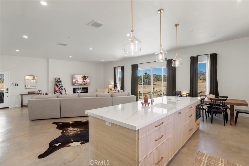 5145 Tom Mix Road Pioneertown, CA 92268 - Photo 22 of 75 a view of living room with granite countertop furniture and a chandelier