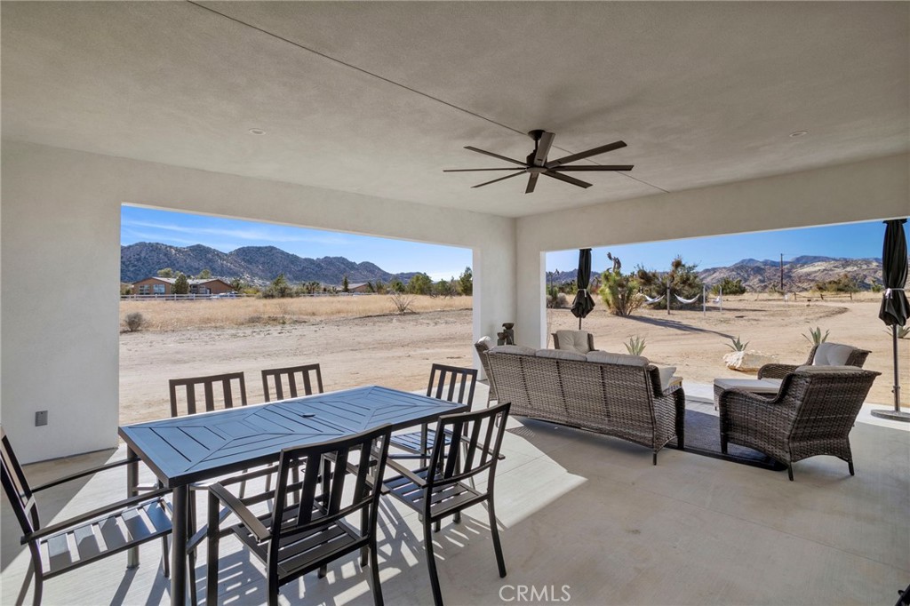 5145 Tom Mix Road Pioneertown, CA 92268 - Photo 40 of 75 a view of a dining room with furniture window and outside view