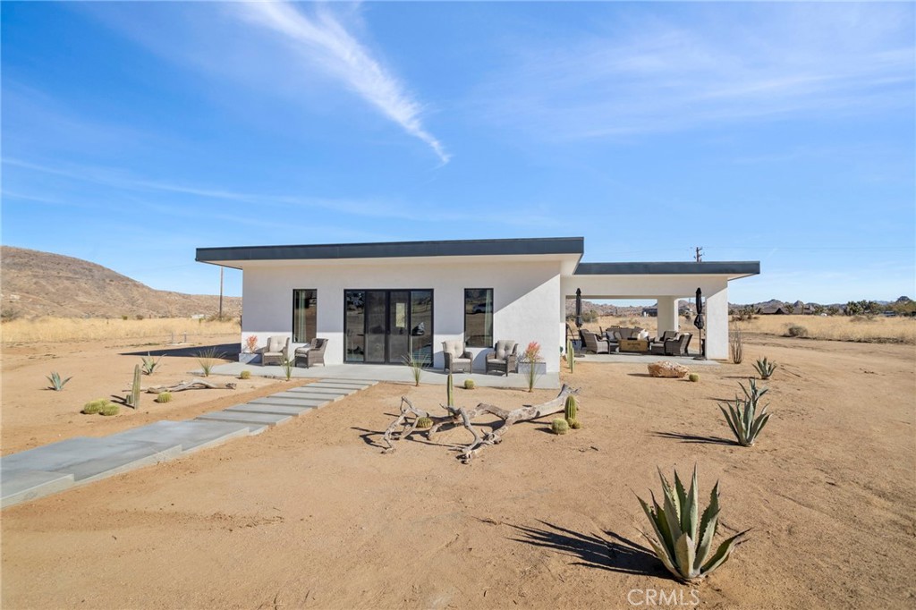 5145 Tom Mix Road Pioneertown, CA 92268 - Photo 6 of 75 a view of a swimming pool and lounge chair