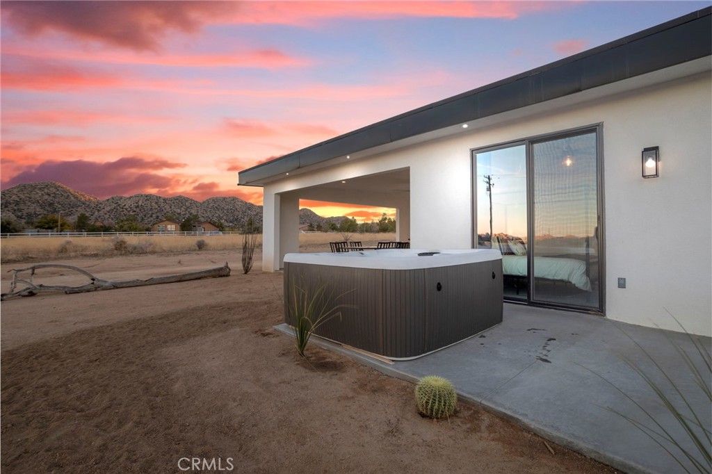 5145 Tom Mix Road Pioneertown, CA 92268 - Photo 70 of 75 a view of a terrace with a garden