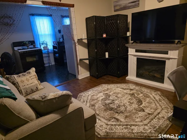 a bed sitting in a bedroom next to a wall