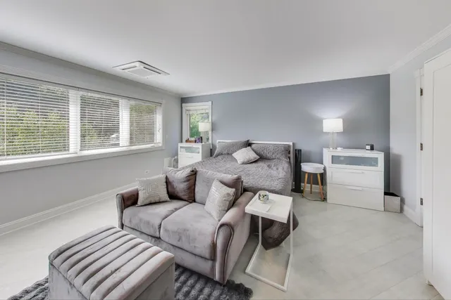 a large bedroom with a large bed and furniture