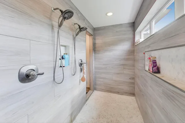 a living room with furniture and chandelier