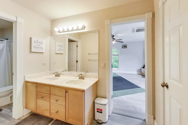 a bedroom with furniture and a window