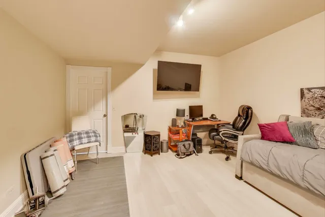 a bedroom with a bed and a dresser