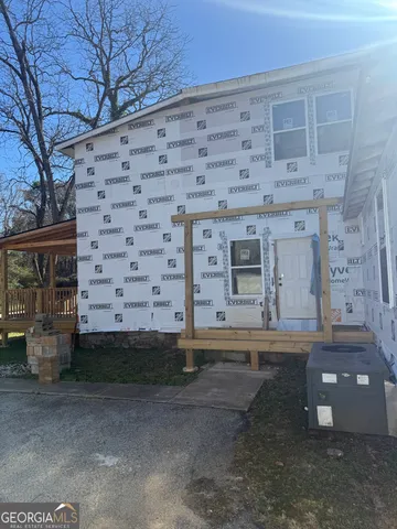 a view of a brick building with many windows