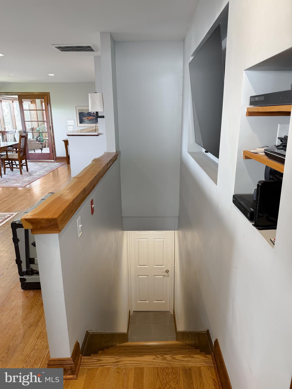 1586 Laurel Road St. Leonard, MD 20685 - Photo 47 of 73 Stairway to mostly unfinished light filled bsmnt.