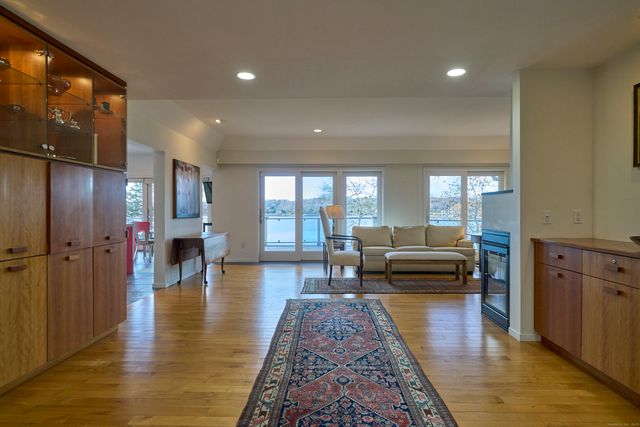 wooden floor in an empty room with a fireplace
