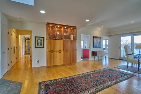 a view of a dining room with furniture and window