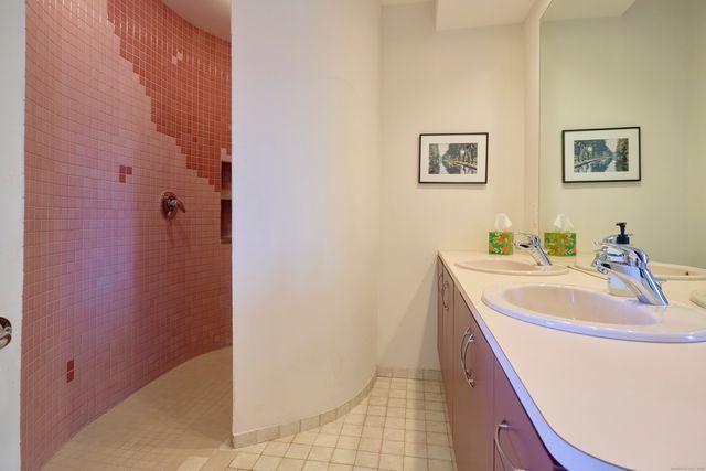 a living room with fireplace furniture and a flat screen tv