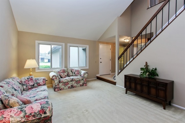 108 Ginger Court Rolling Meadows, IL 60008 - Photo 2 of 15 a living room with furniture and stairs