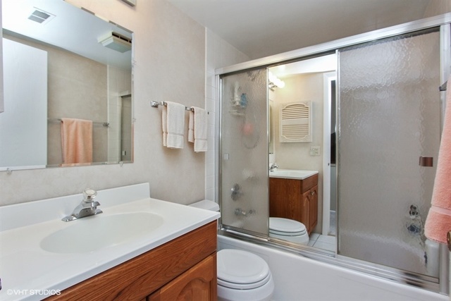 108 Ginger Court Rolling Meadows, IL 60008 - Photo 12 of 15 a bathroom with a sink toilet and shower