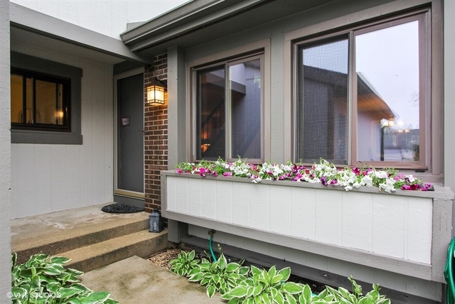 108 Ginger Court Rolling Meadows, IL 60008 - Photo 15 of 15 a bunch of flowers in front of the house