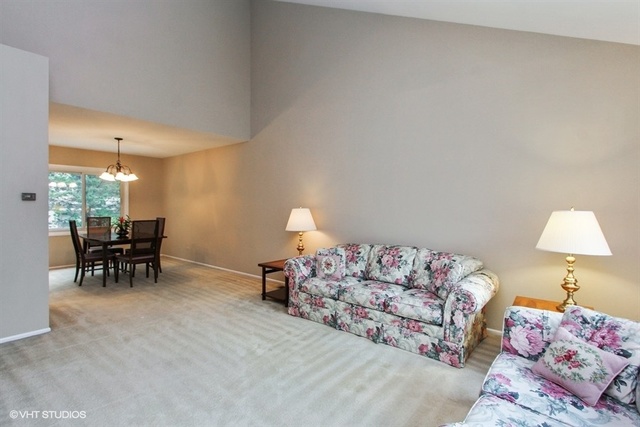 108 Ginger Court Rolling Meadows, IL 60008 - Photo 3 of 15 a bedroom with furniture and a bed