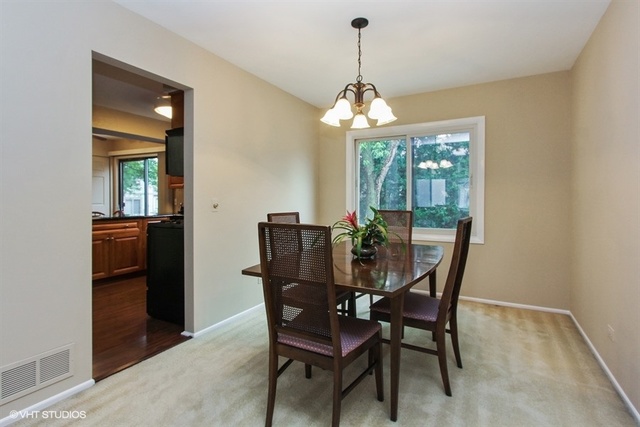 108 Ginger Court Rolling Meadows, IL 60008 - Photo 6 of 15 a view of a dining room with furniture window and outside view