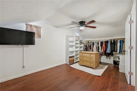 a view of a livingroom with furniture and a flat screen tv