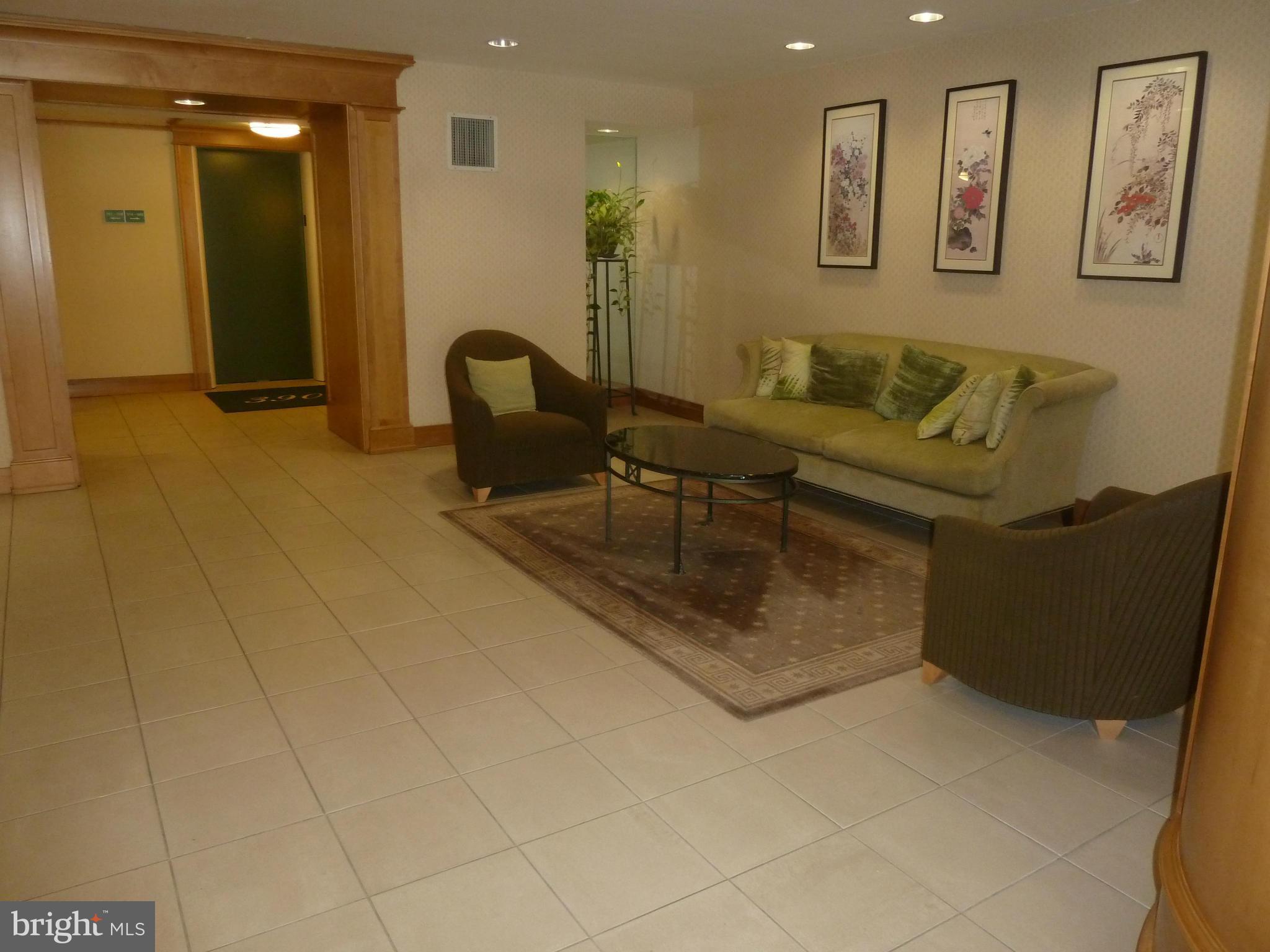3900 Tunlaw Road Northwest, Unit 610 Washington, DC 20007 - Photo 19 of 22 a living room with furniture