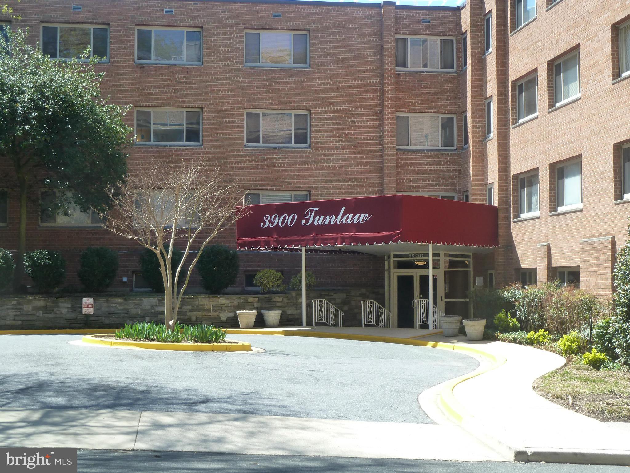 3900 Tunlaw Road Northwest, Unit 610 Washington, DC 20007 - Photo 21 of 22 a view of a brick building with a large window