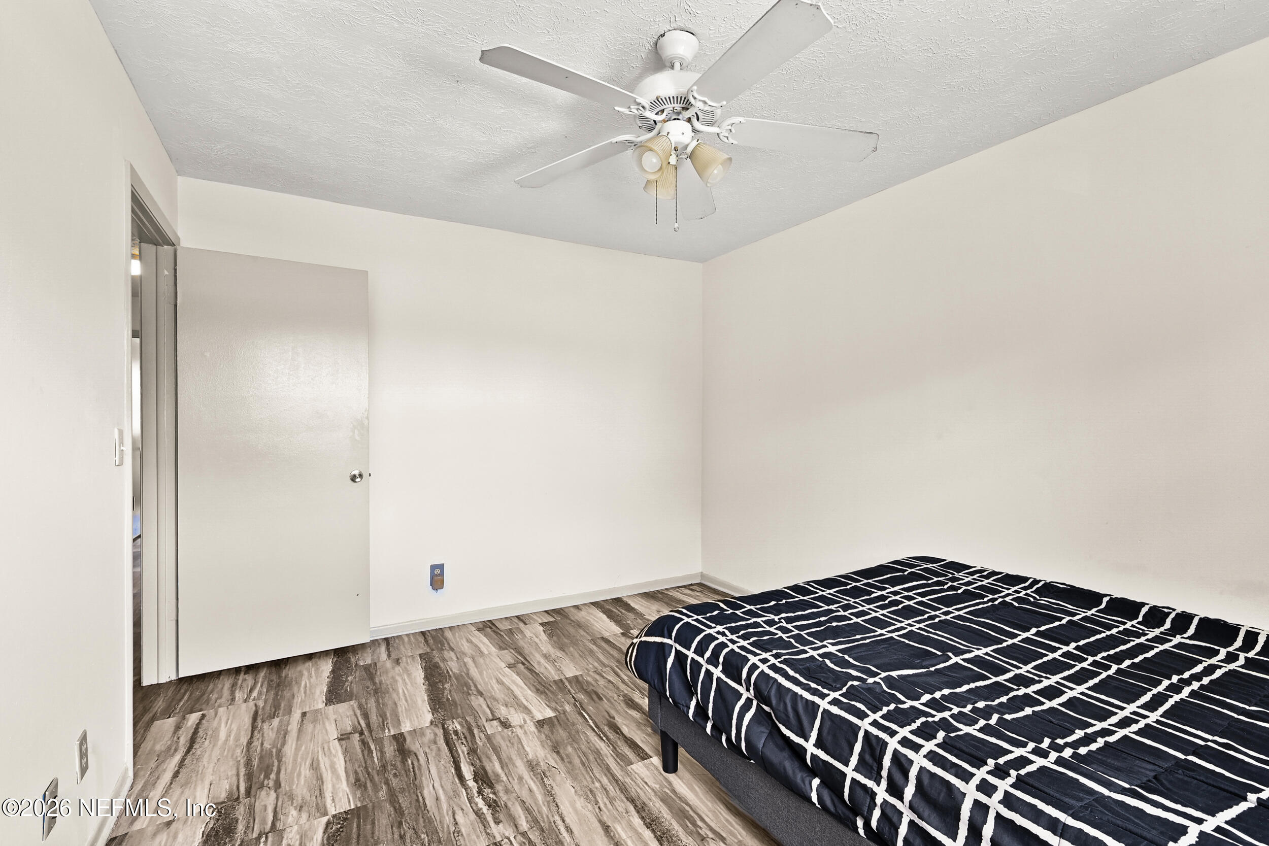 4915 Baymeadows Road, Unit 6G Jacksonville, FL 32217 - Photo 28 of 44 an empty room with wooden floor