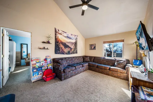 a kitchen with stainless steel appliances granite countertop a refrigerator a sink dishwasher and wooden cabinets with wooden floor