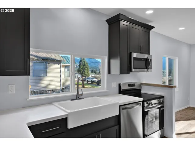 a kitchen with a refrigerator and a sink